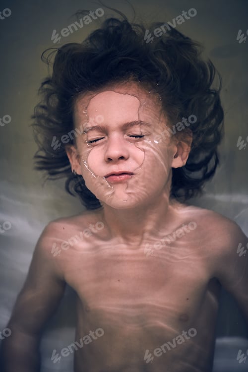 Preview: Funny little boy diving in bathtub at home