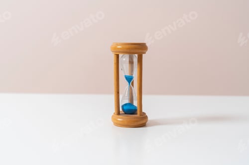Preview: a wooden antique hourglass, abstract time management concept