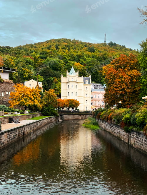 Preview: Autumn Landscape With Old City Architecture With Reflection At Riverside And Gloomy Cloudy Weather