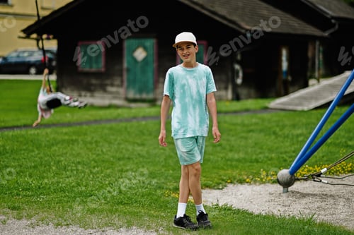 Preview: Boy playing at playground in Hallstatt, Austria.