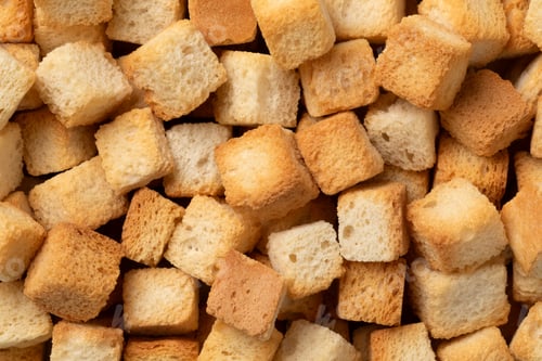 Preview: Fresh baked croutons for seasoning close up full frame