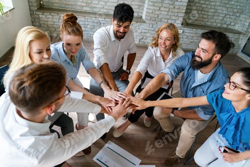 Preview: Happy diverse success business team celebrating success and having fun all together.