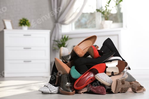 Preview: Pile of female shoes on floor indoors
