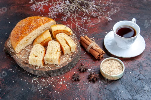 Preview: front view sweet pastry sliced in pieces with cup of tea on dark background cake dough pie