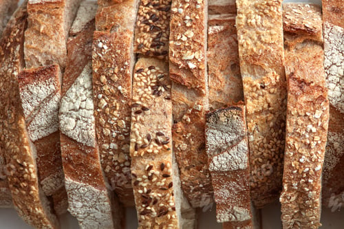 Preview: Macro photo of different pieces of fresh bread with flax seeds and sesame seeds. Healthy food. Flat
