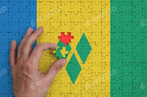 Preview: Saint Vincent and the Grenadines flag is depicted on a puzzle, which the man