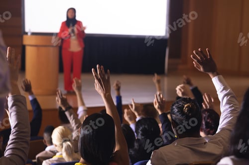 Preview: Businesswoman standing around the podium in the auditorium