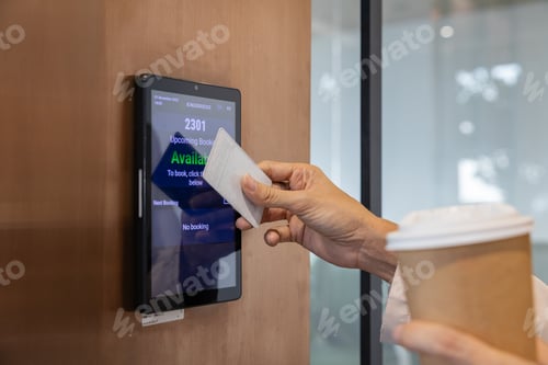 Preview: Office worker scanning access card with coffee