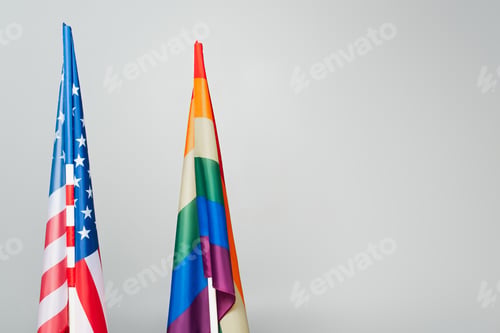 Preview: american and colorful lgbt flags isolated on grey, equality rights concept