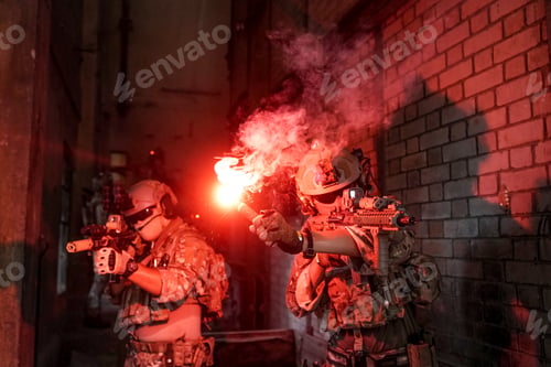 Preview: Soldier in full US MARSOC armed with assault rifle run through the abandoned building. Military