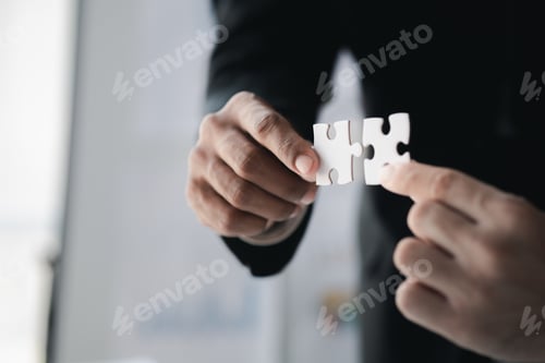 Preview: Group business people holding jigsaw puzzle together, Business man group are meeting together in the