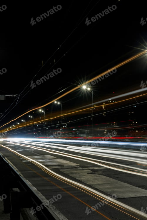 Preview: long exposure of bright lights on road at night busy city