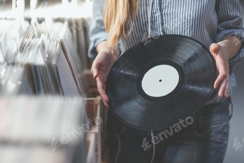 Preview: Female hands with a record