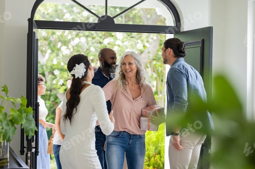 Preview: Guests arriving at wedding, greeting bride with smiles and gift at entrance