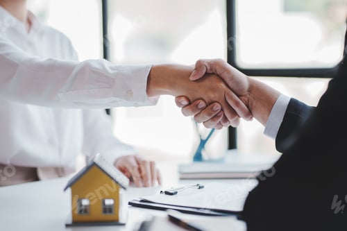 Preview: Handshake real estate agents deliver sample homes to customers. mortgage loan agreement Make a contr