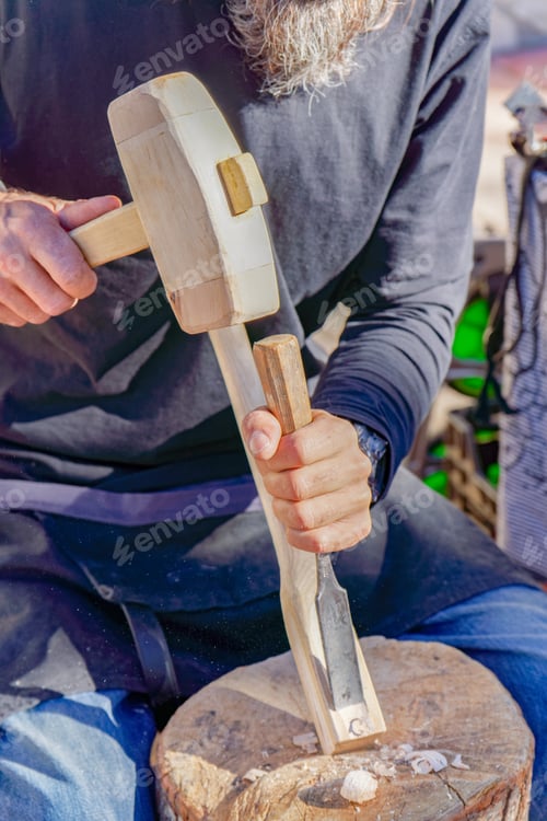 Preview: craftsman working with wood at a street market