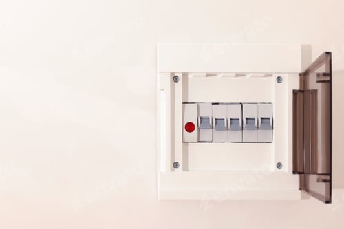 Preview: Open fuse box on beige wall. Space for text