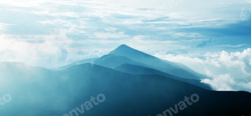 Preview: Panorama of beauty blue foggy mountains range