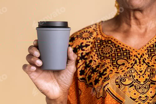 Preview: Indian man holding a tumbler mockup