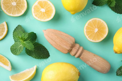Preview: Flat lay composition with fresh lemons on turquoise background