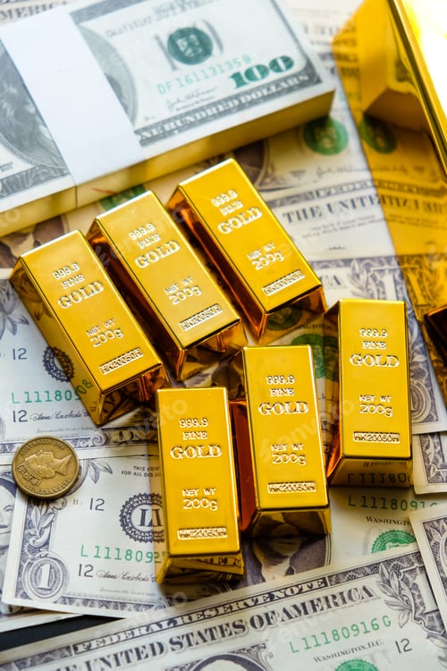 Preview: Gold bars on the background of dollar bills.
