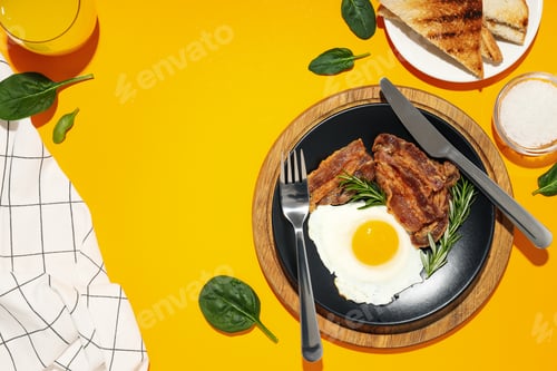 Preview: Fried bacon and egg - tasty breakfast, top view