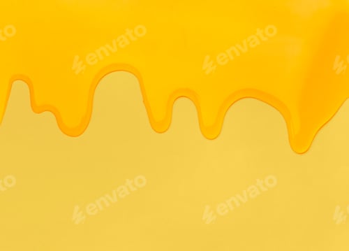 Preview: Pouring honey on a yellow background.