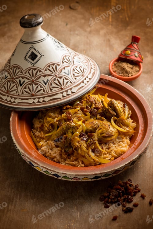 Preview: traditional moroccan chicken tajine with vegetables and dried grapes