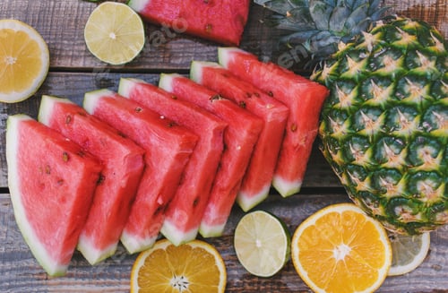 Preview: Top view image of colorful fruits on wooden background. Pineapple, watermelon citrus, oranges.