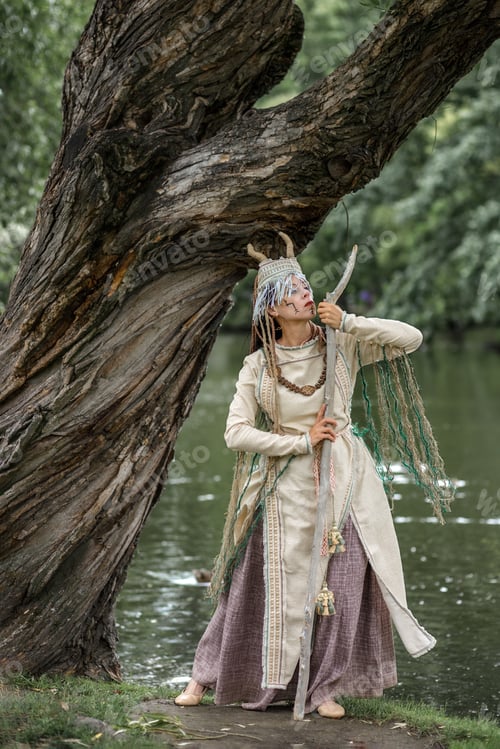 Preview: Beautiful girl in ethnic Karelian costume in nature