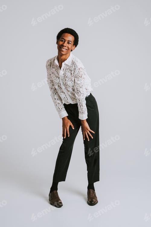 Preview: Fashionable fluid gender man posing in studio