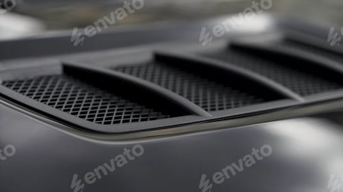 Preview: Air intake in the carbon hood of sport car. Stock. Luxury car exterior details.