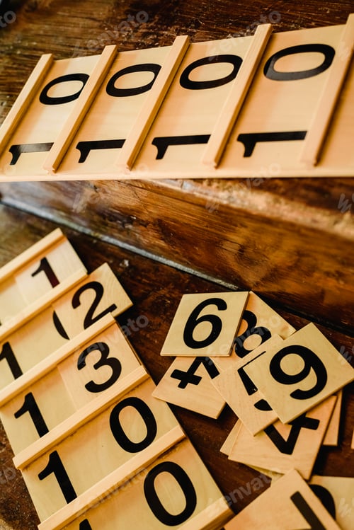 Preview: Wooden numbers in tables to learn mathematics in a Montessori classroom.