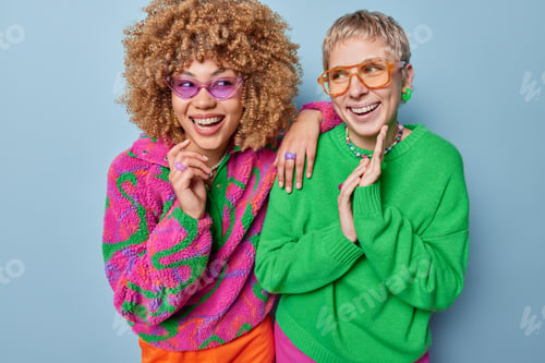 Preview: Positive young pretty women laugh gladfully wear spectacles and casual clothes have fun enjoy