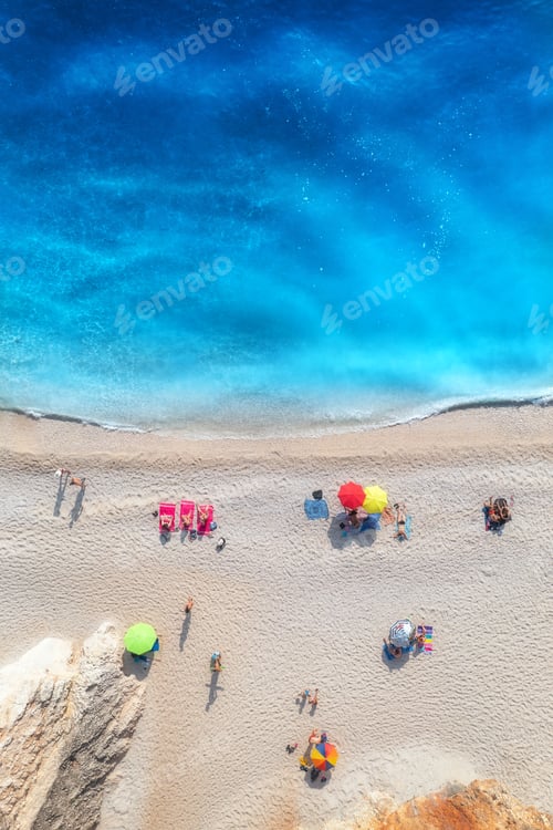 Preview: Aerial view of adriatic sea, waves, sandy beach and umbrellas