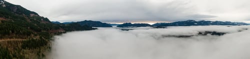Preview: Aerial Panoramic View of Canadian Mountain Landscape covered in fog over Harrison Lake
