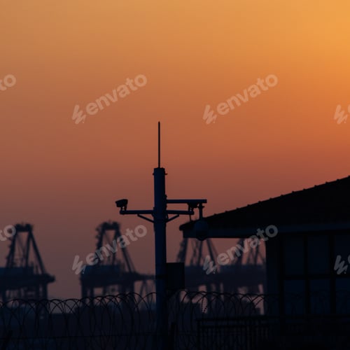 Preview: Silhouette of an industry and equipment at sunset