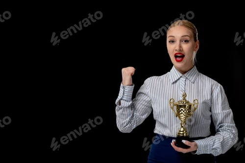 Preview: Business woman blonde excited girl holding trophy nomination with red lipstick in office outfit