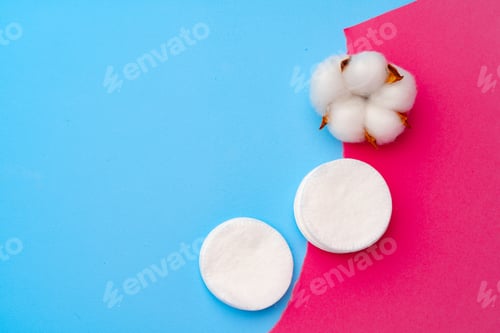 Preview: Cotton flower and cotton discs on paper background