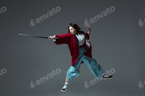 Preview: samurai in kimono fighting with katana in jump isolated on grey