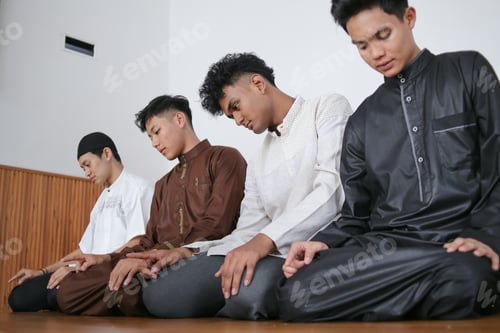 Preview: Muslim People In A Line On Sitting Position Performing Salah Together