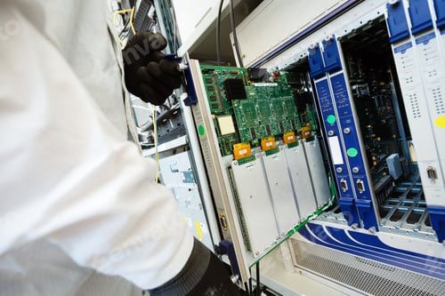 Preview: Picture of technician repairing cmts networking cards