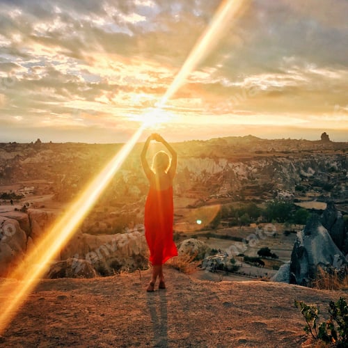 Woman in Red Dress at Scenic Sunrise View