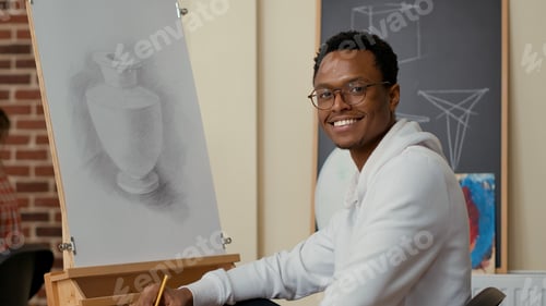 Preview: Portrait of african american man using drawing technique with pencil