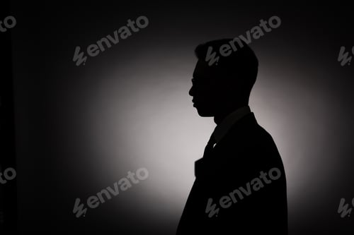 Preview: side view of black silhouette of businessman with back light