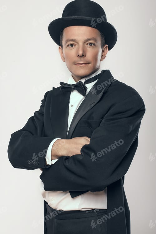 Preview: Man in black tuxedo and cylinder hat.