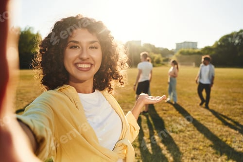 Preview: Modern style, selfie time. Young friends are having fun on the field