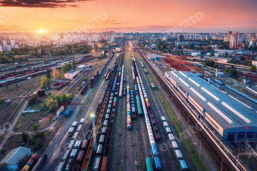 Preview: Aerial view of freight trains at sunset. Top view of railroad