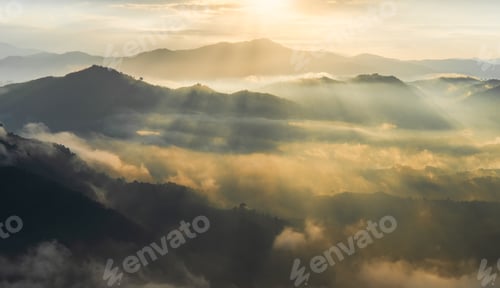 Preview: Sunset sky clouds and mist flow over mountain forest, Horizon landscape with orange sunlight