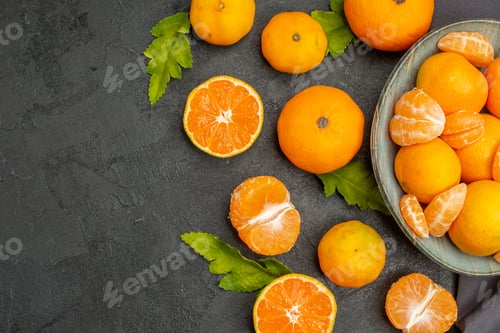 Preview: top view tasty juicy tangerines on a dark background color sour exotic photo orange fruit citrus